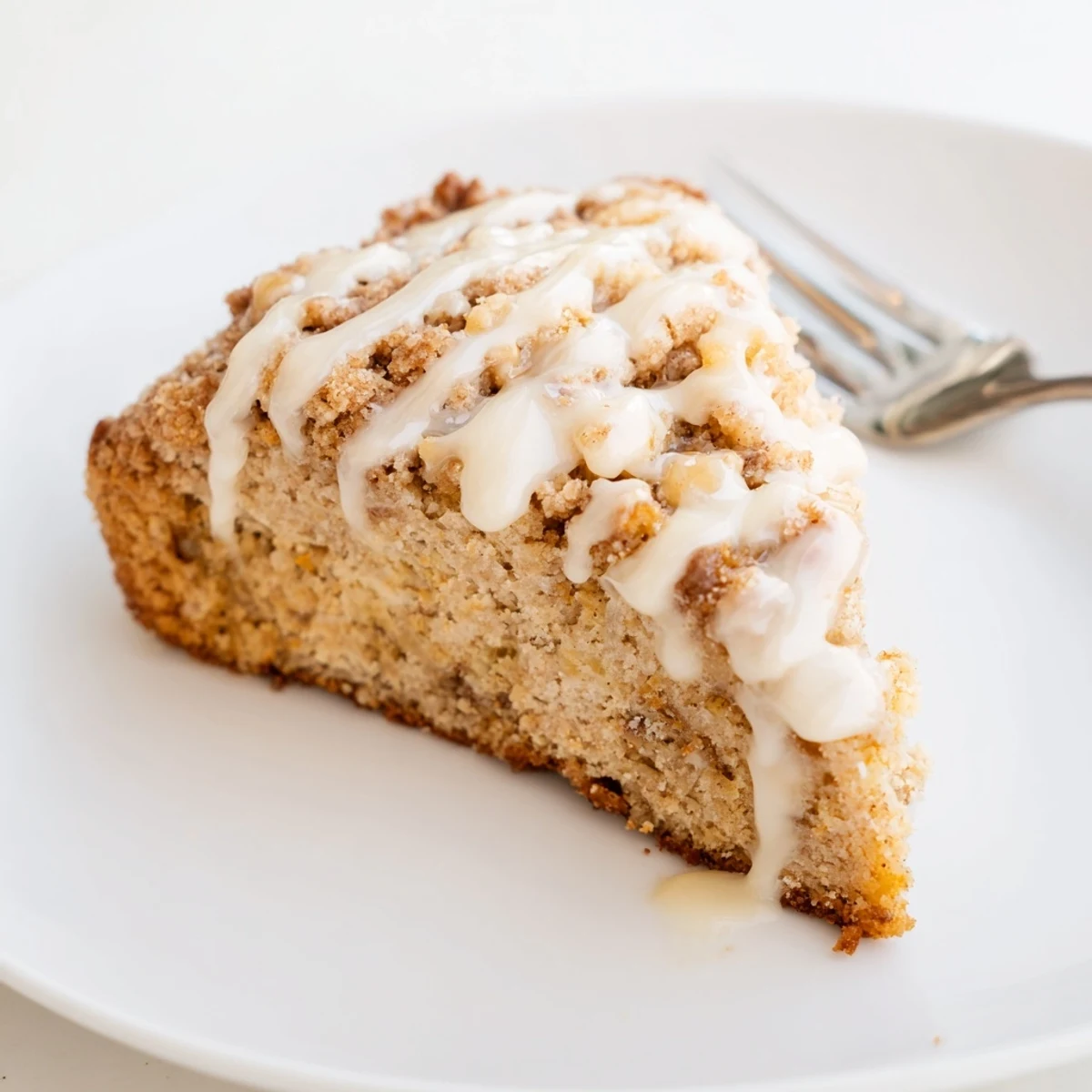Tender Banana Cream Coffee Cake Scones topped with crunchy streusel and vanilla glaze.