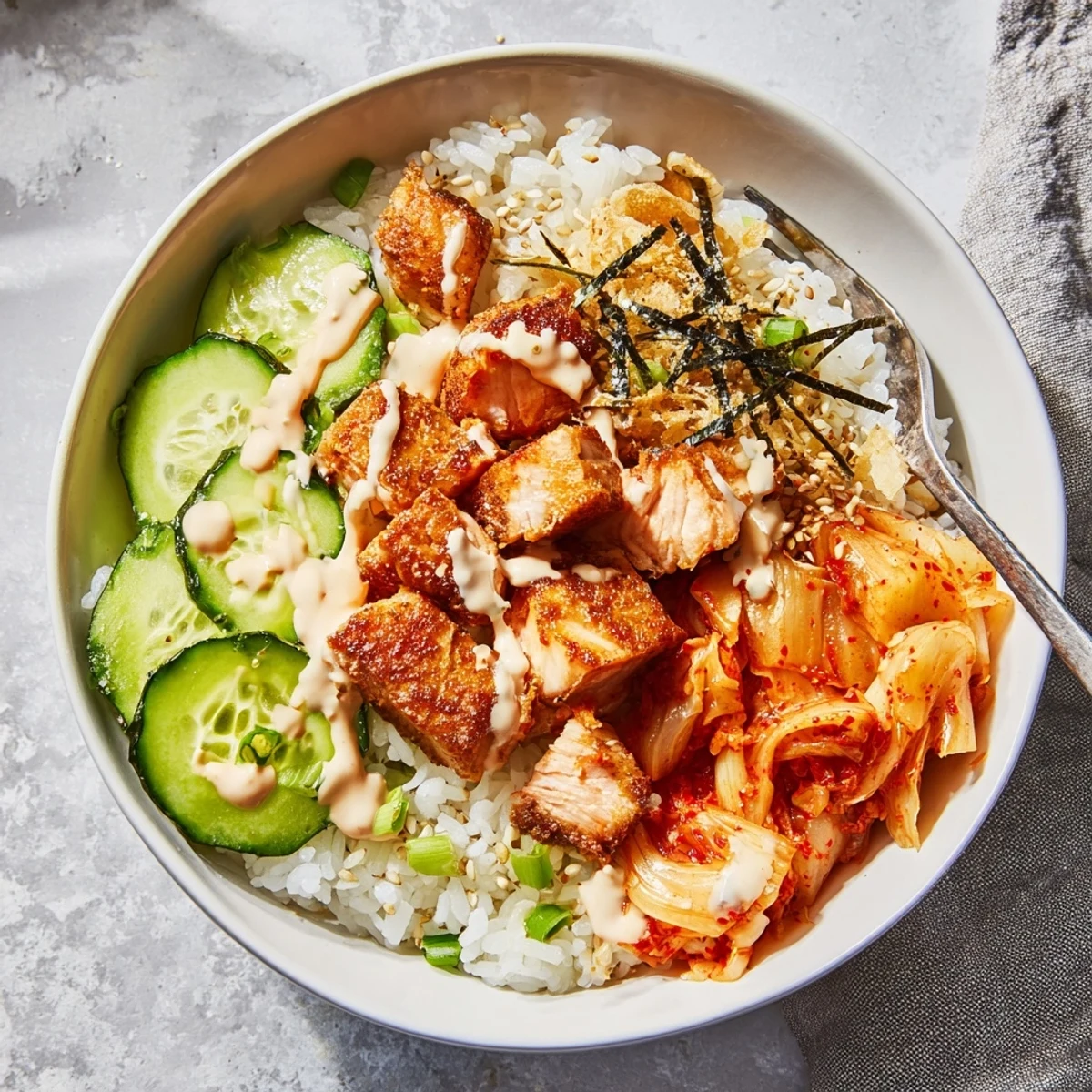 Vibrant Crispy Salmon Rice Bowl featuring colorful toppings and rich Sriracha mayo drizzle.