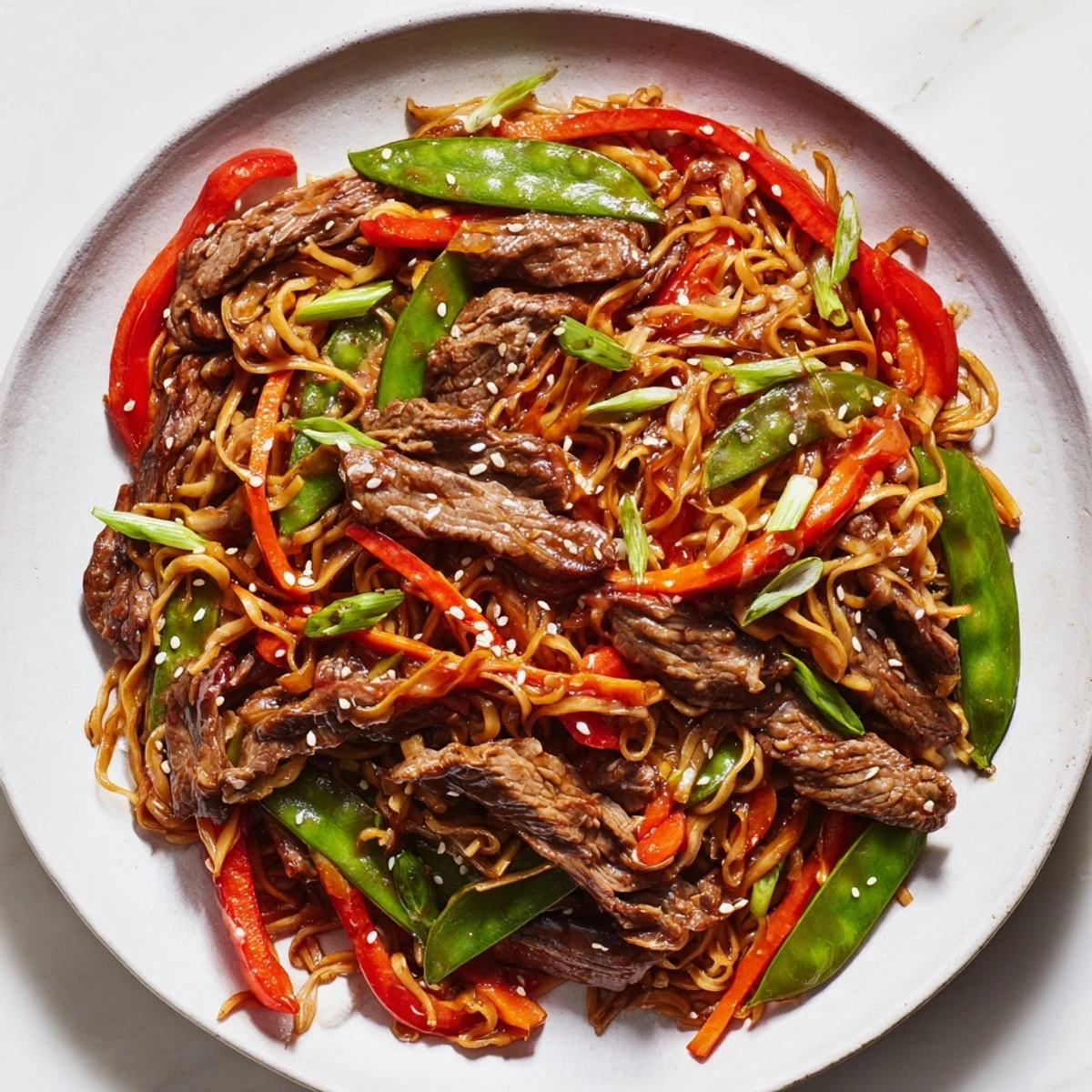 This vibrant Teriyaki Beef & Noodle Bowl features tender beef, crisp veggies, and a glossy sauce.