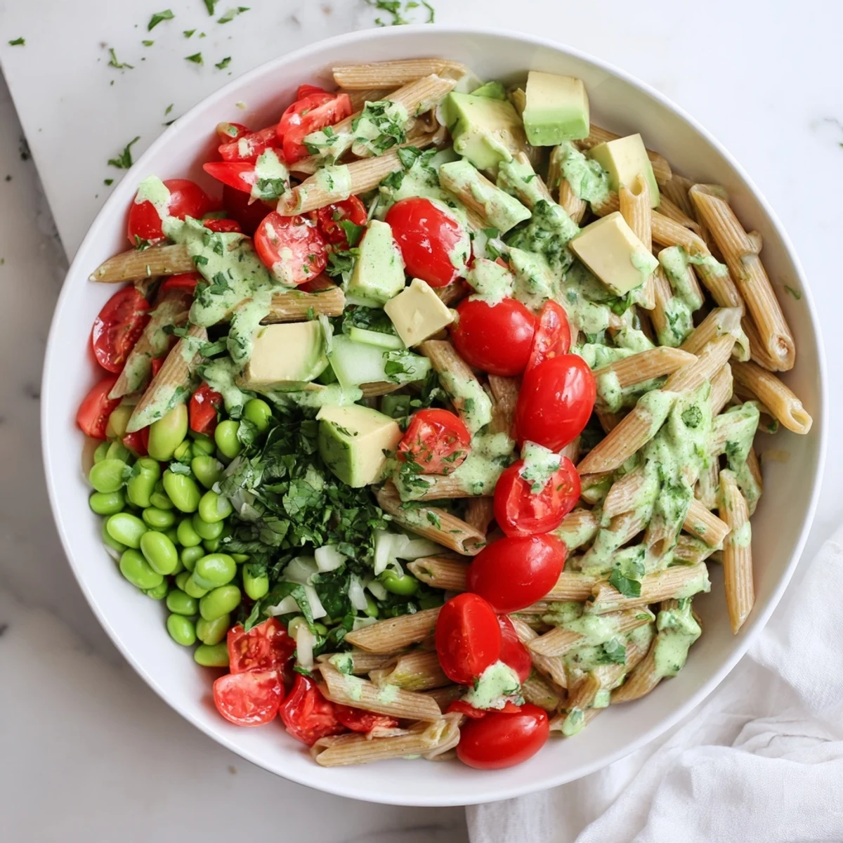 Vibrant Holiday Glow Green Goddess Protein Pasta Salad, featuring creamy dressing and fresh veggies.