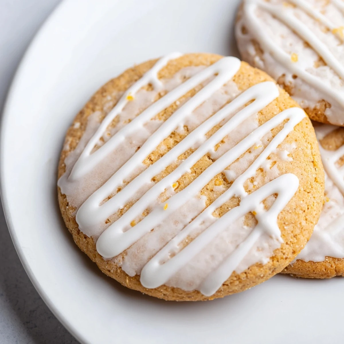 Homemade Holiday Cookies with Icing Drizzle, glistening with a creamy drizzle, perfect for sharing during the holidays.