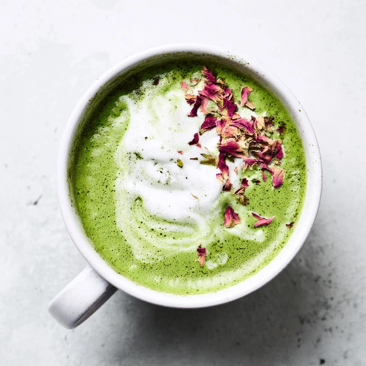 Steaming Cozy Peppermint Matcha Christmas Latte, creamy and festive, topped with whipped cream and crushed candies.