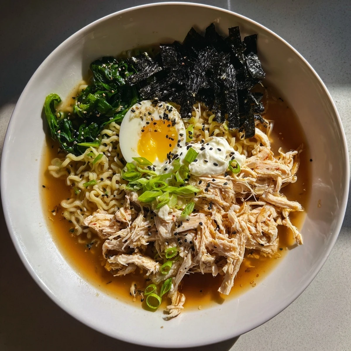 Steaming Chicken Ramen with Kewpie Mayo; a bowl of comfort with soft egg and greens.