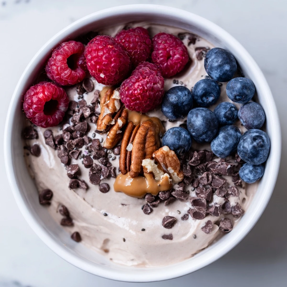 Freshly made, high-protein Protein Ice Cream Bowl with a smooth, scoopable texture, delicious.