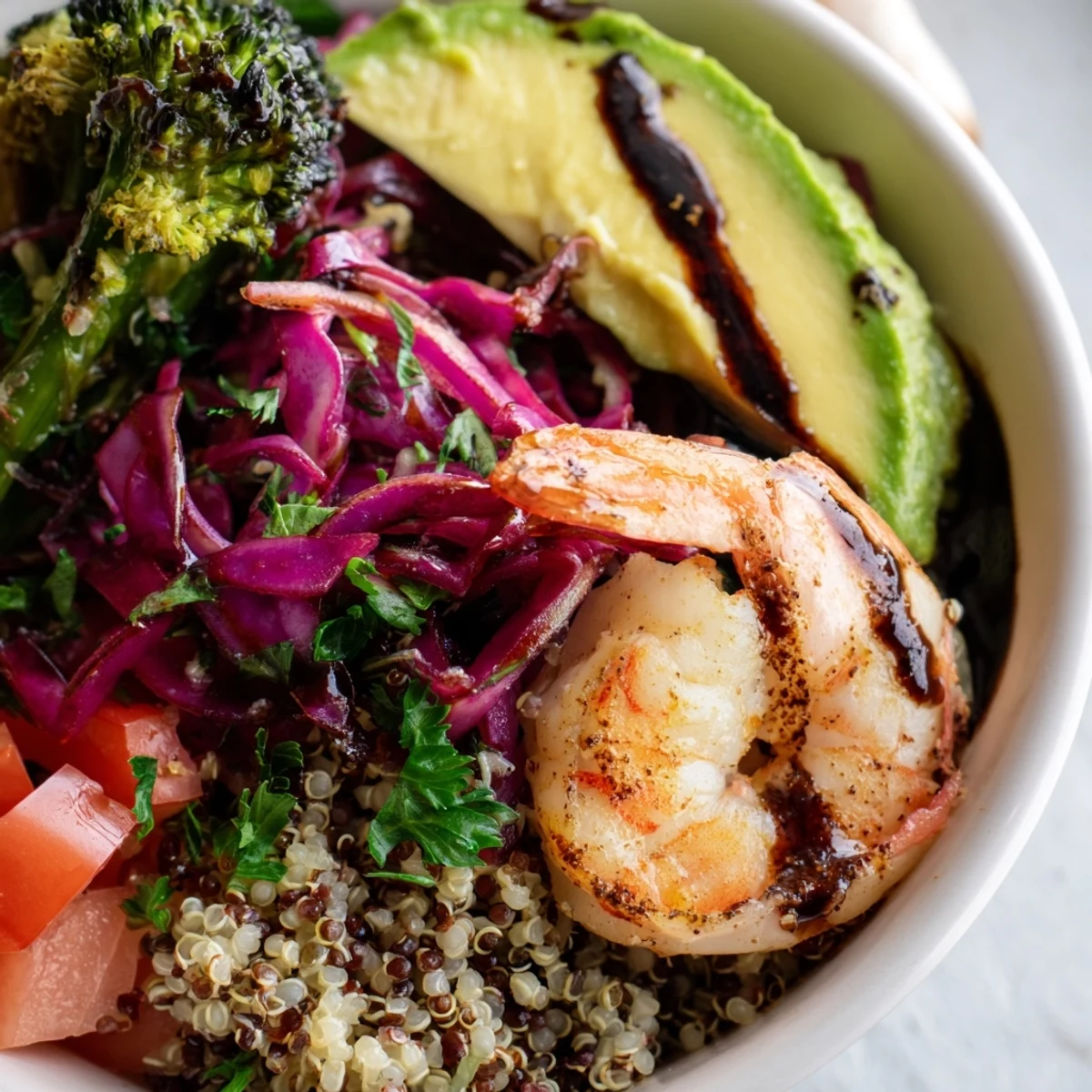 Colorful Detox Buddha Bowl with Shrimp and Quinoa featuring fluffy grains, red cabbage, and a tangy balsamic drizzle.