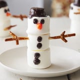 A close-up of the finished Marshmallow Snowman Stick Arrangement, ready for a winter dessert platter.