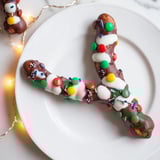 Festive pretzel sticks and dip Christmas lights: colorful candy melts make a delicious no-bake holiday treat.