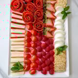 Festive Peppermint Stripe Celebration platter, showcasing alternating rows of fresh, bright red and white ingredients.