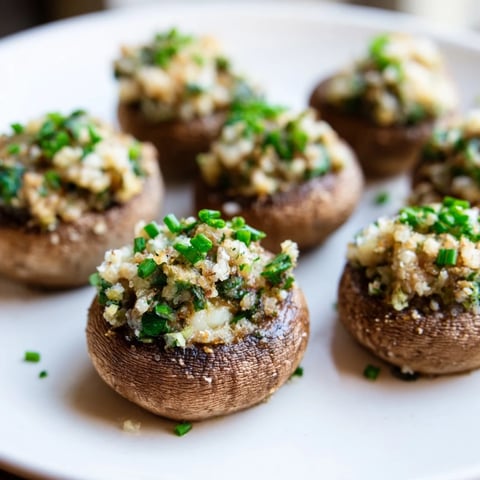 Golden-brown Enchanted Forest Mushroom Nibbles, savory and cheesy, perfect for a party appetizer.