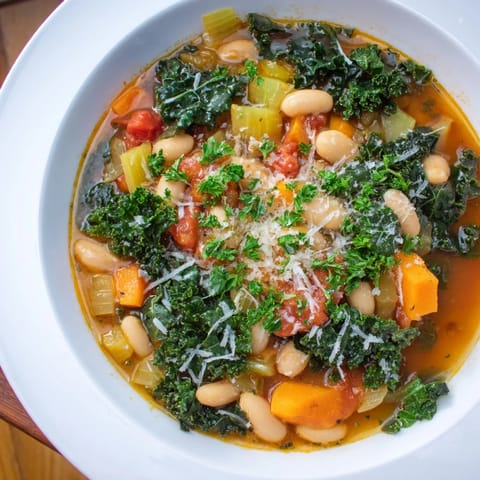 A close-up of the delicious Italian Bean & Kale Stew, a hearty vegetarian meal, ready to enjoy.