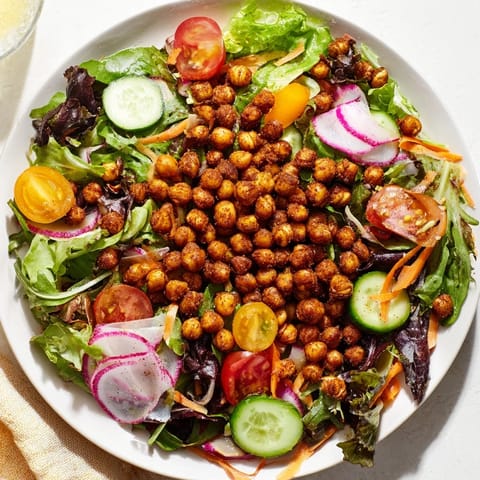 Golden, crunchy chickpea croutons top a refreshing Mixed Greens Salad, ideal for a light lunch.