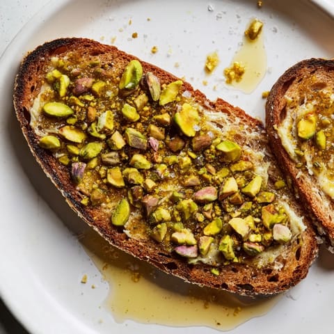 Close-up of freshly prepared pistachio butter toast, ready to be enjoyed as a tasty snack.