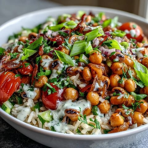 A large serving bowl of New Years Hoppin John Salad featuring chickpeas, black-eyed peas, diced vegetables, and fresh parsley garnish.