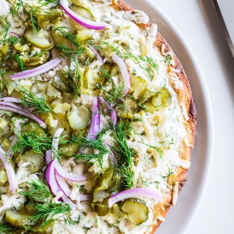 Sizzling Pickle Pizza fresh from the oven, featuring gooey cheese and zesty pickles.