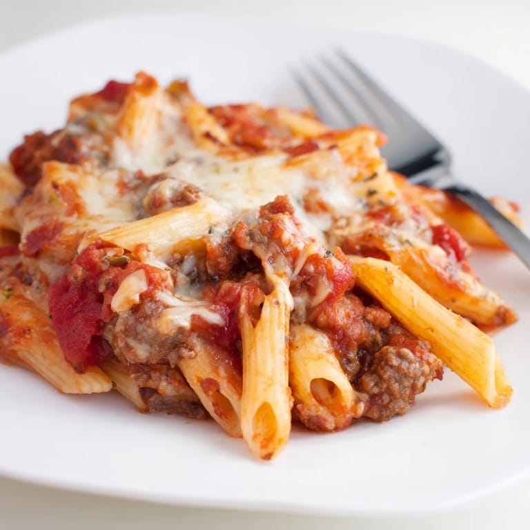 Delicious Cheesy Beef & Penne Bake, piled high with savory ground beef and tender pasta.