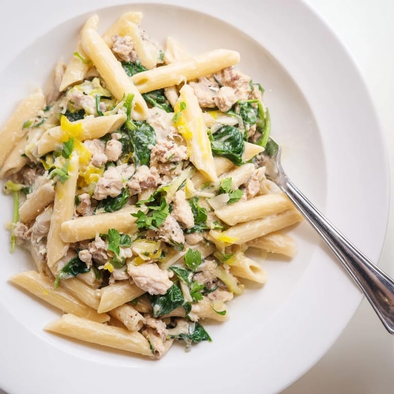 Tender turkey and vibrant spinach star in this festive one-pot creamy spinach & turkey pasta creation.