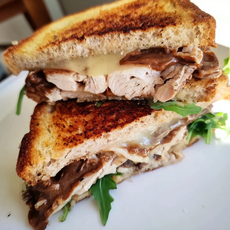 Melting brie cheese and tender chicken layered in this decadent Nutella Grilled Cheese, ready to eat.